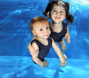 young children swimming