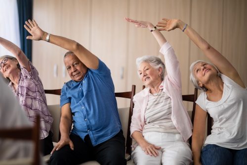 Individuals doing chair based exercise